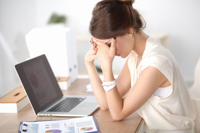Woman with migraine headache, stress