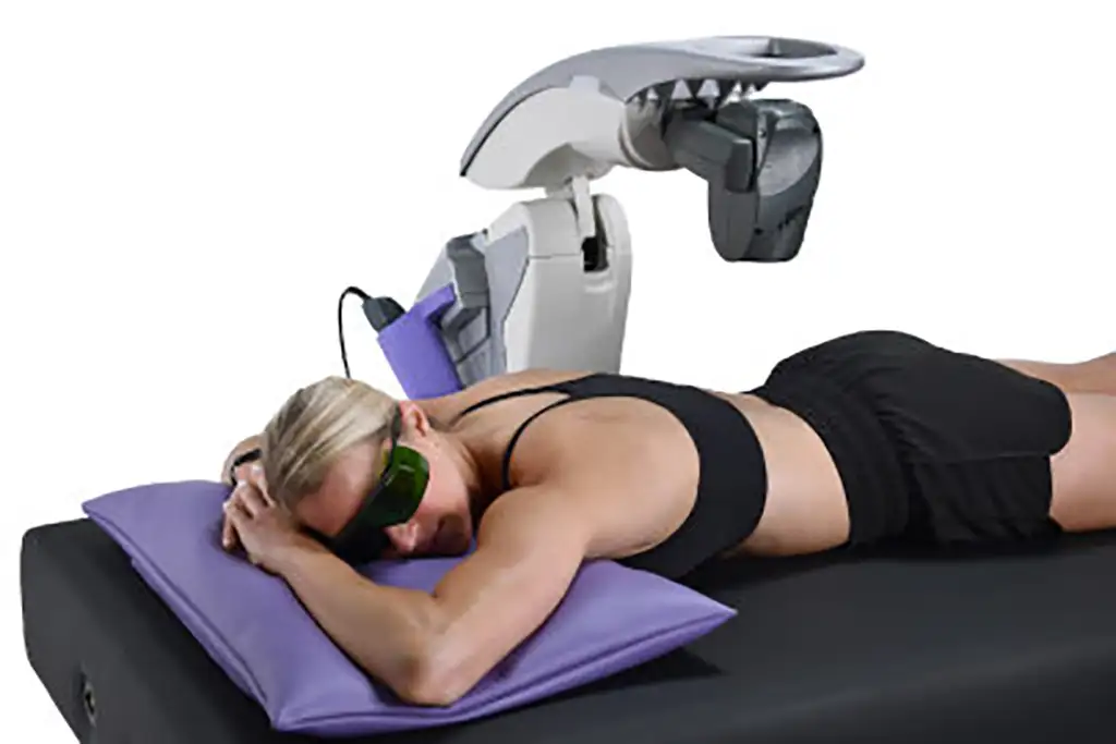 MLS laser therapy being used on lower back of woman