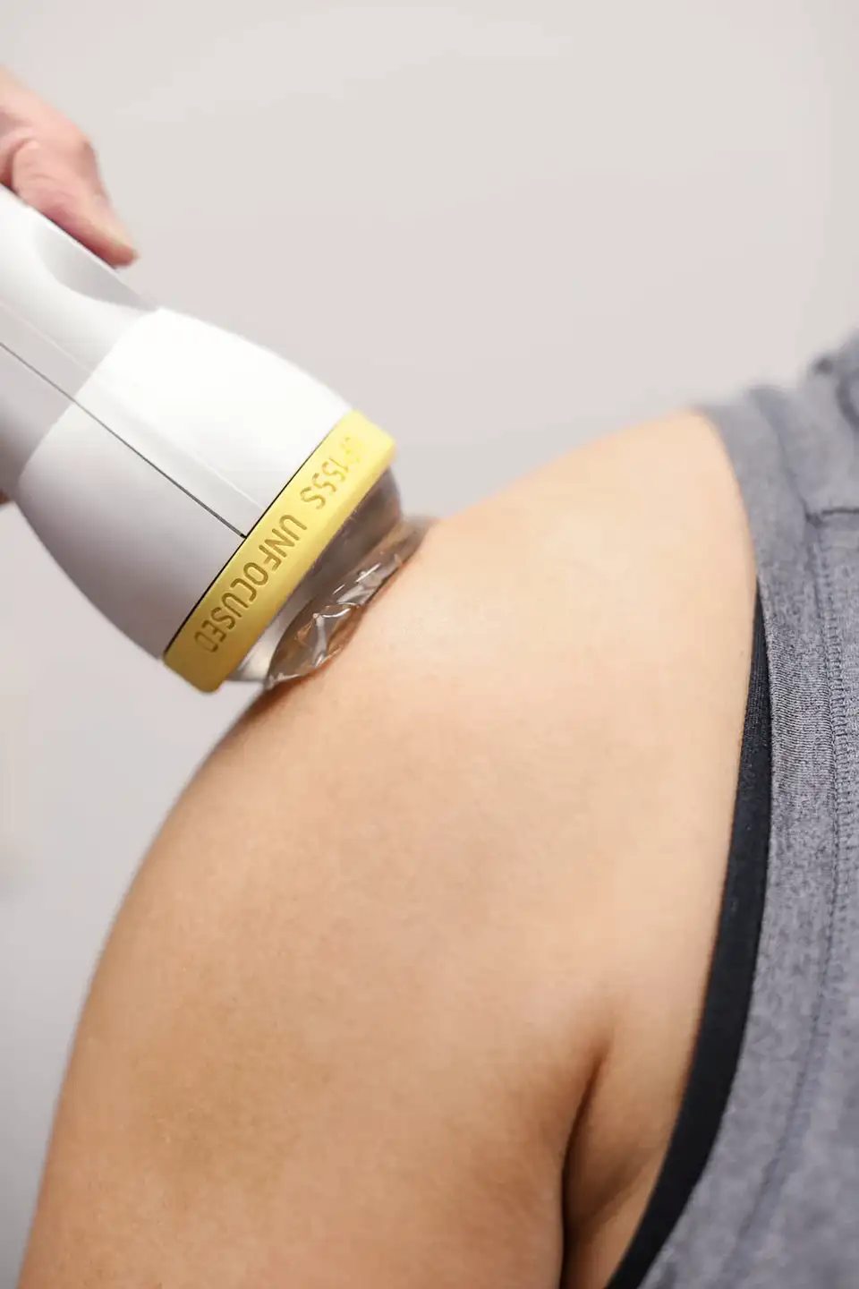 SoftWave Therapy being used on patient's shoulder