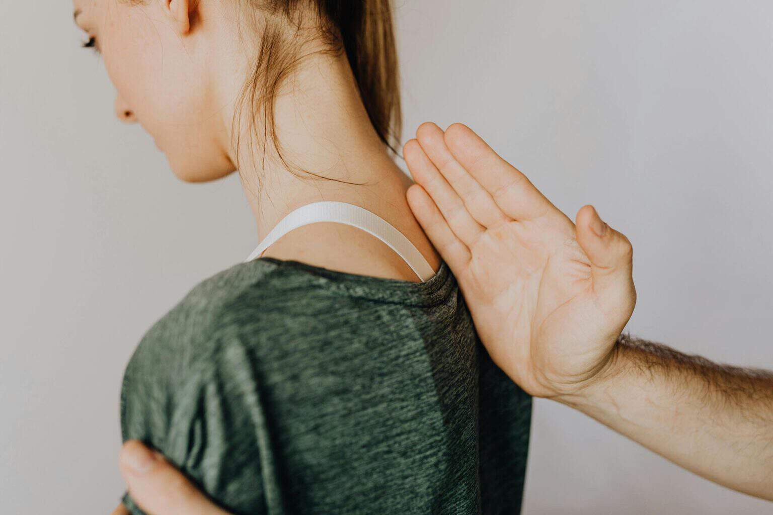 Woman getting chiropractic exam and adjustment