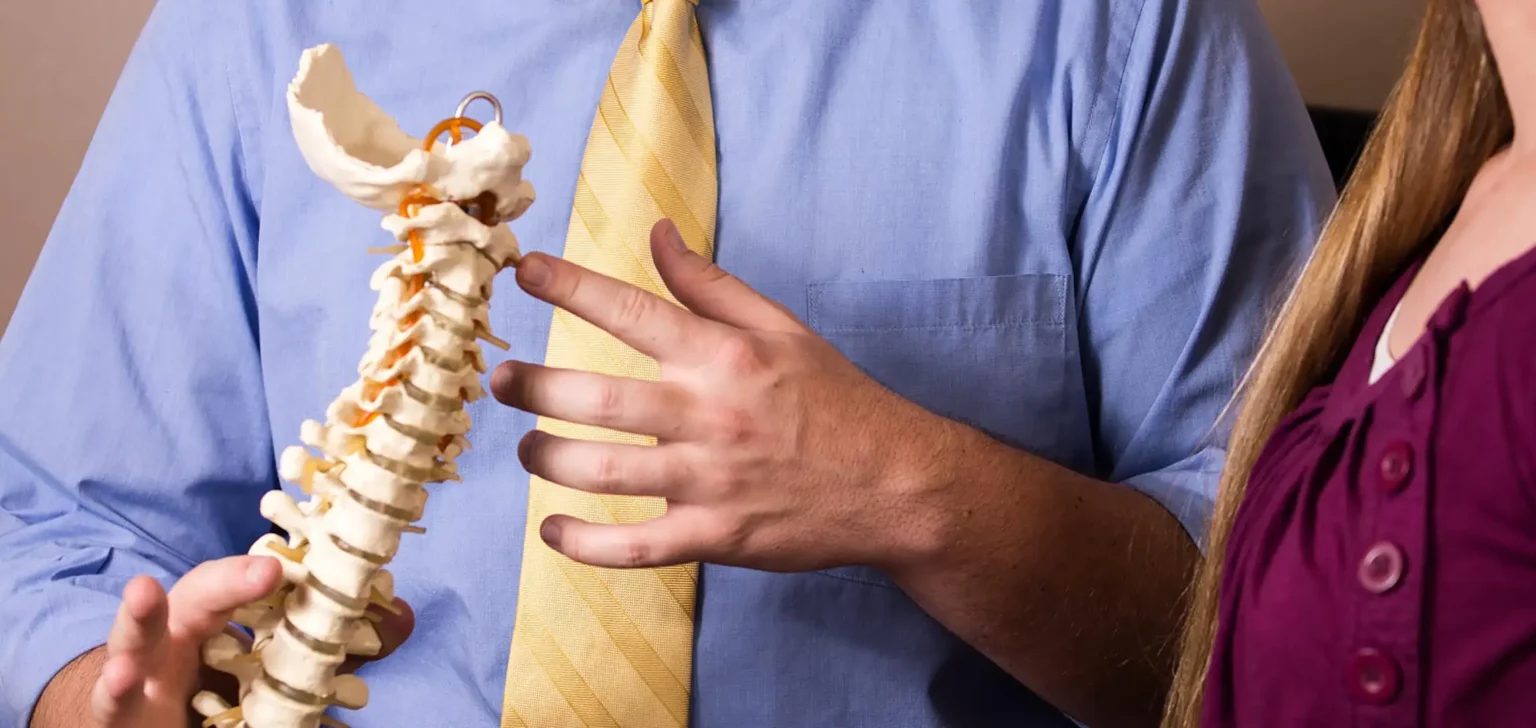 Chiropractor explaining to patient about upper cervical care