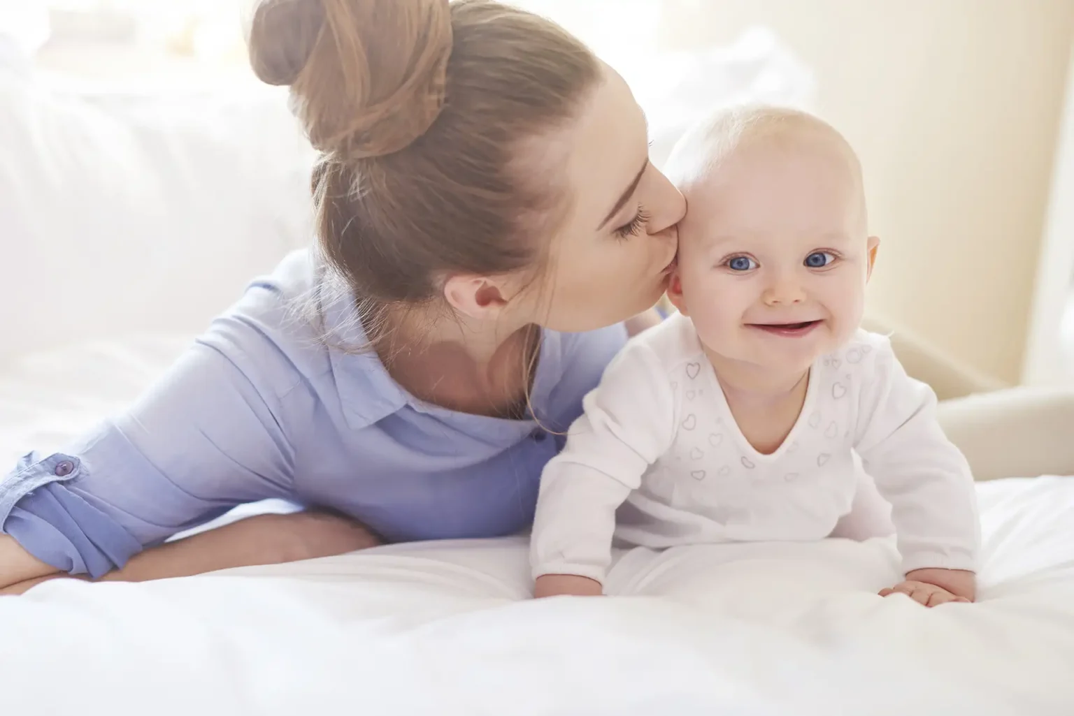 Mother with young baby having fun